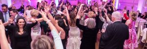 bride dancing in a crowd during her reception